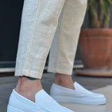 Men's casual white loafers, front angle with moc seam and stitched vamp