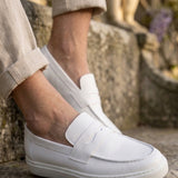 White men's loafers with slip-on strap, stitched apron, and low cushioned sole