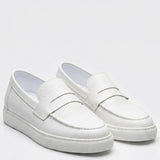 Studio view of white men's loafers with slip-on strap and stitched apron front
