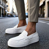 Men's white loafers with strap and stitched sole, close side view
