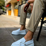 Men's casual light blue loafer with buckle strap, side view
