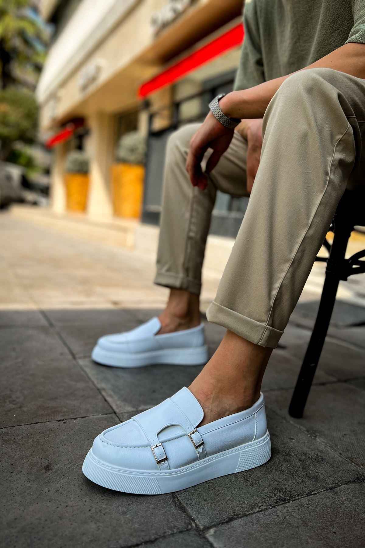 Men's casual light blue loafer with buckle strap, side view