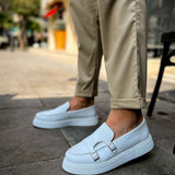 Men's casual light blue loafer with buckle strap, front profile view