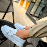 Men's casual light blue loafer with square buckle strap, close-up