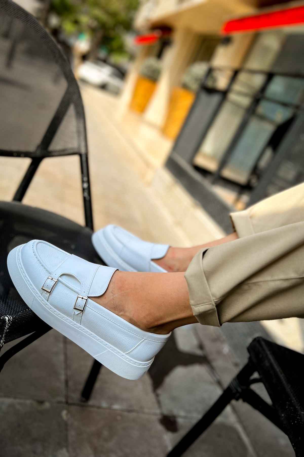 Men's casual light blue loafer with square buckle strap, close-up