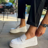 Men's white slip-on loafer, side view with stitched upper and strap tab