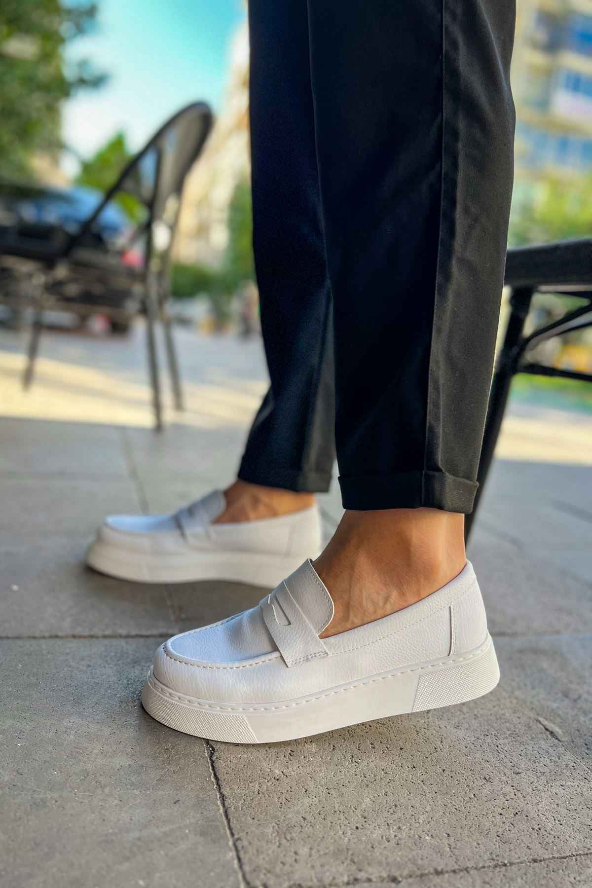 Men's white loafer shoe, side profile with thick rubber sole