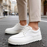 Men's casual white lace-up shoes with thick rubber sole and stitched panels