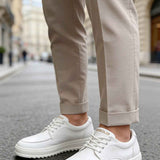 Men's casual white lace-up sneakers with round toe and contrast stitching