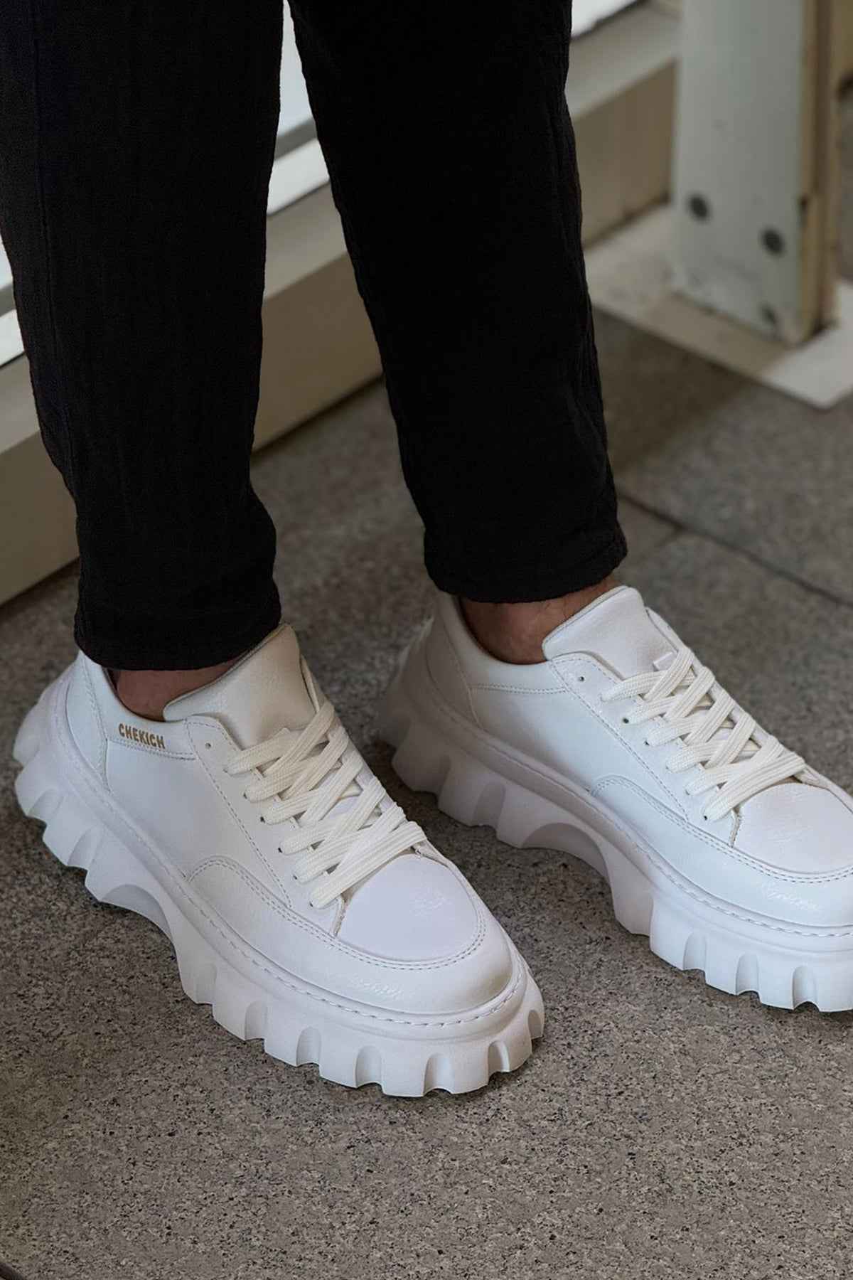 Men's white low-top sneakers, lace-up with thick lug sole and smooth leather upper