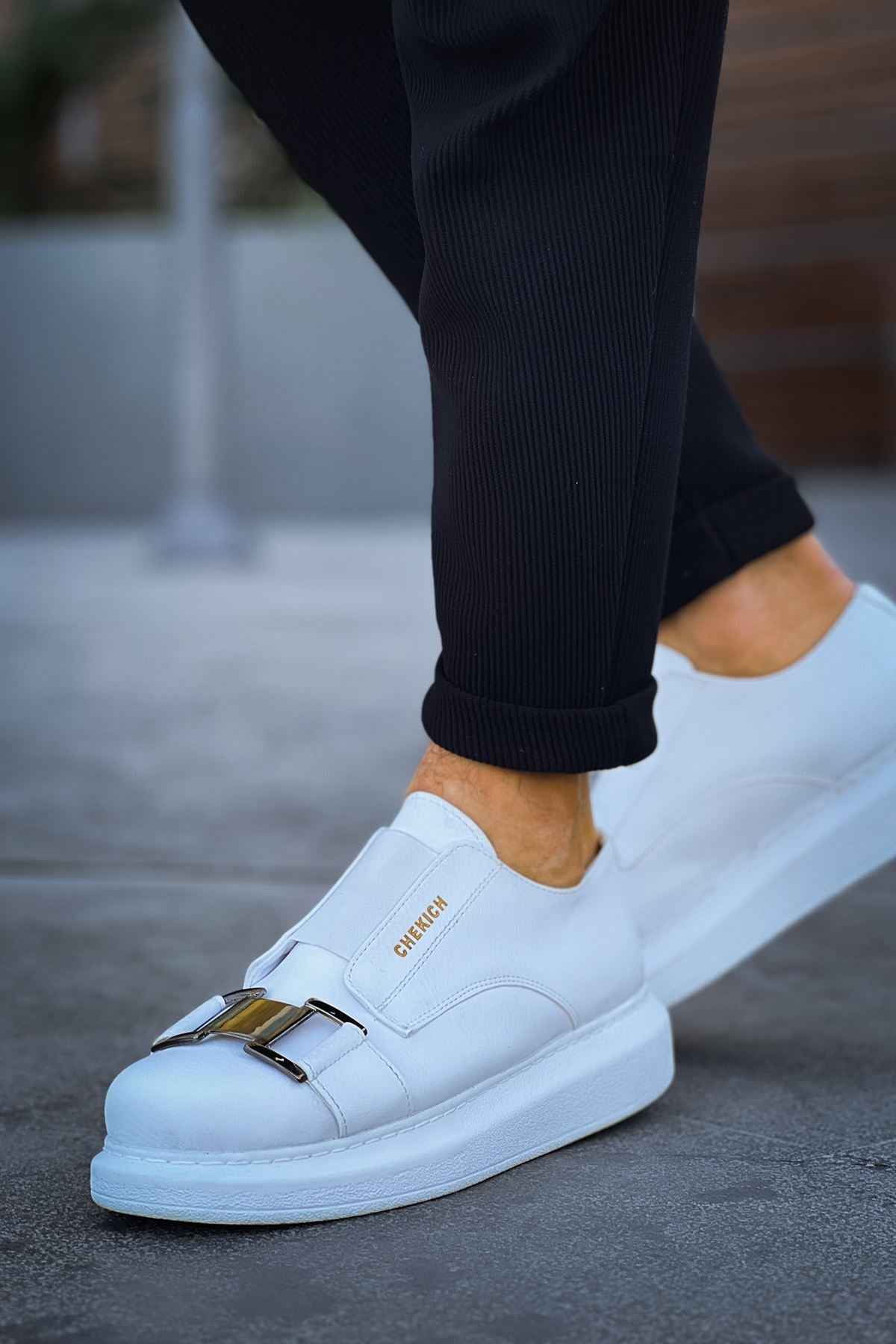 Men's white casual sneakers with double buckle strap, low-top design.