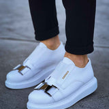 Men's white sneakers with side buckle strap and smooth leather upper.