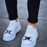 Men's white sneakers, front view, double strap buckle detail and rubber sole.