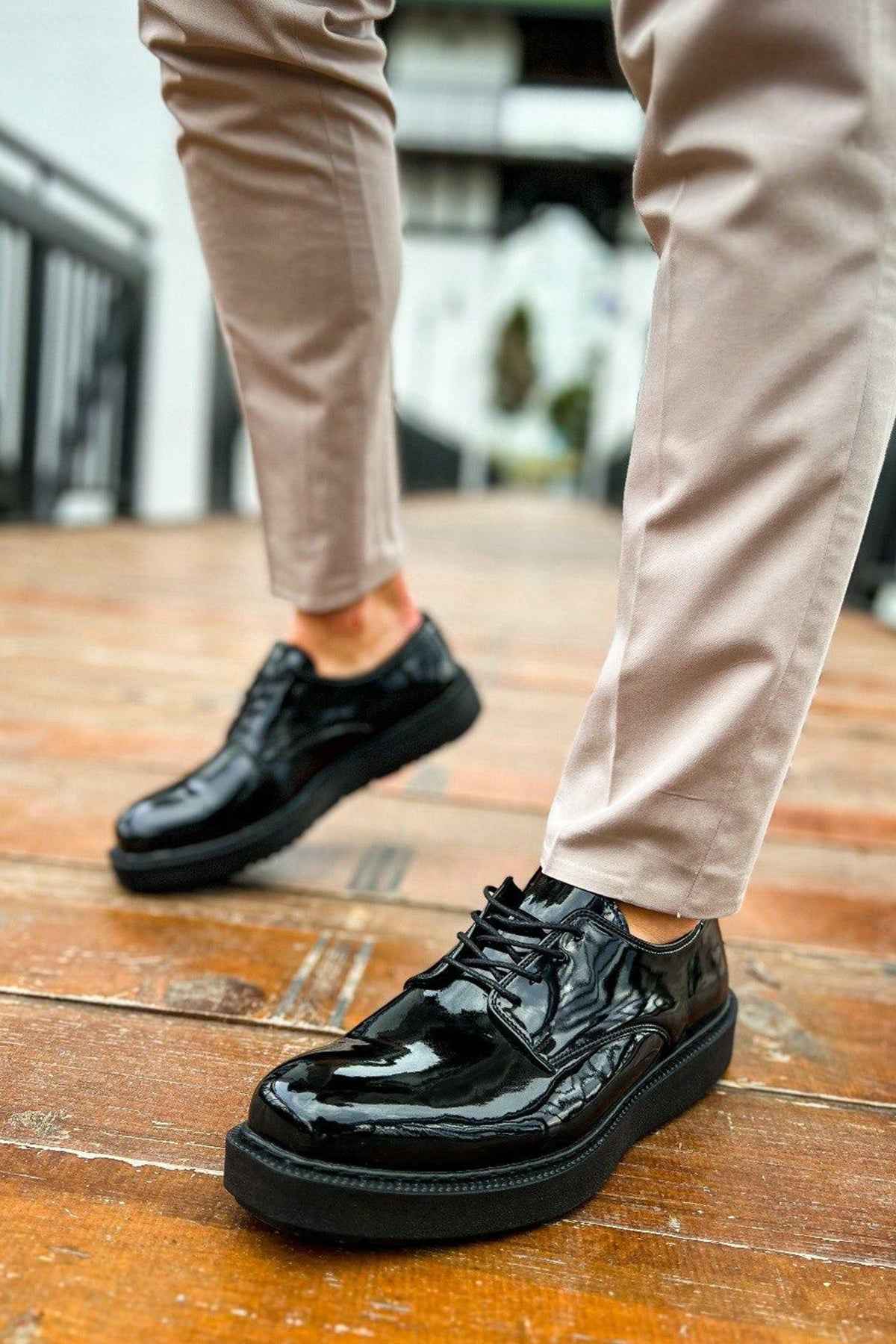 Men's black patent leather lace-up shoes with stitched apron and chunky sole