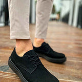 Black suede lace-up shoes with textured seam and rubber sole