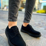 Black suede lace-up shoes, low-profile heel and stitched moc toe