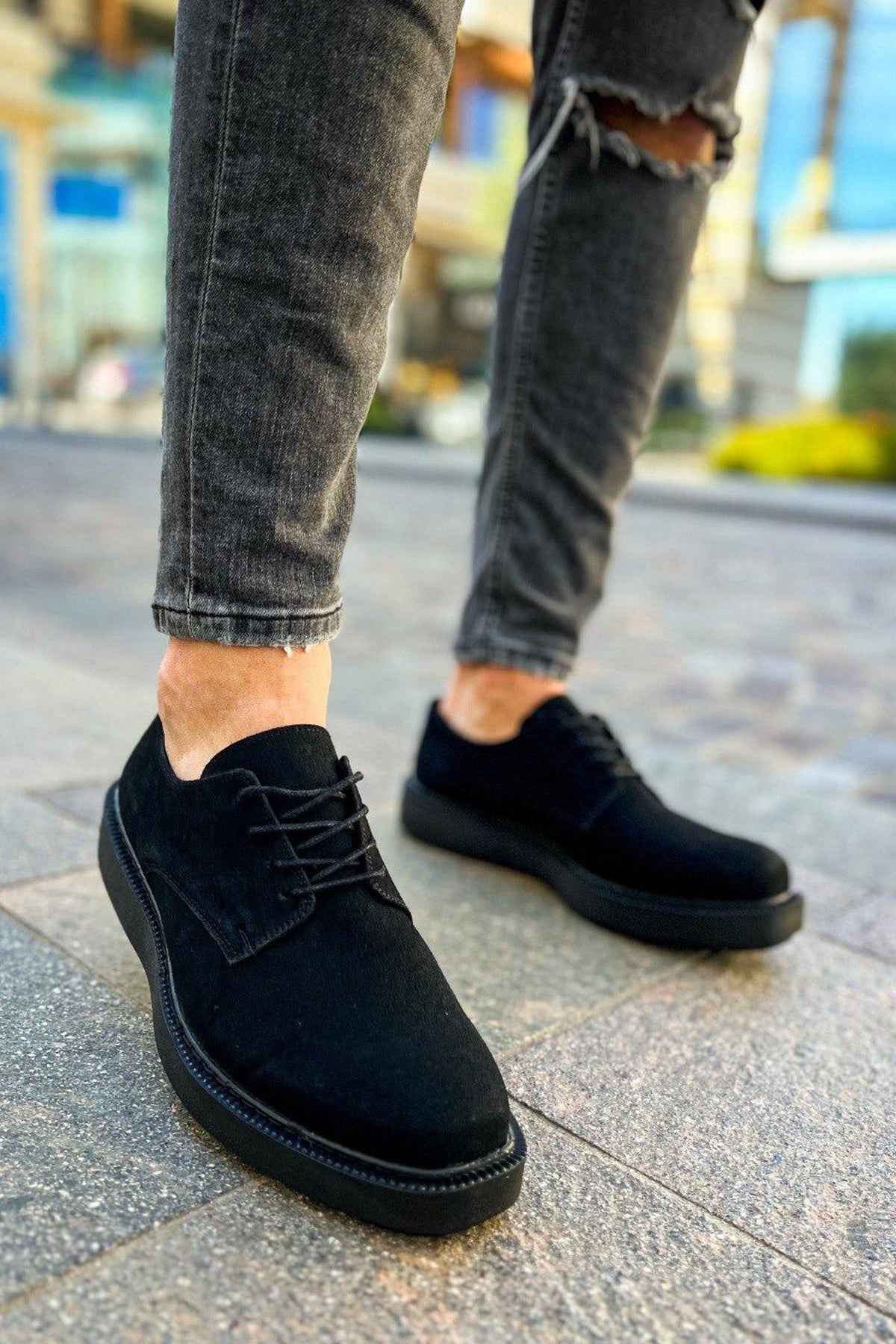 Black suede lace-up shoes, low-profile heel and stitched moc toe
