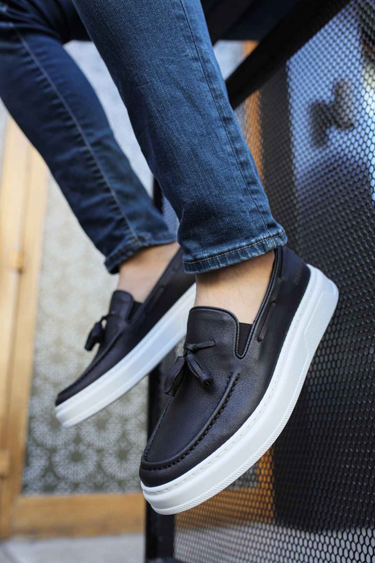 Men's black tassel loafers with white rubber sole