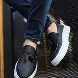 Men's black loafers with bow detail and white sidewall sole