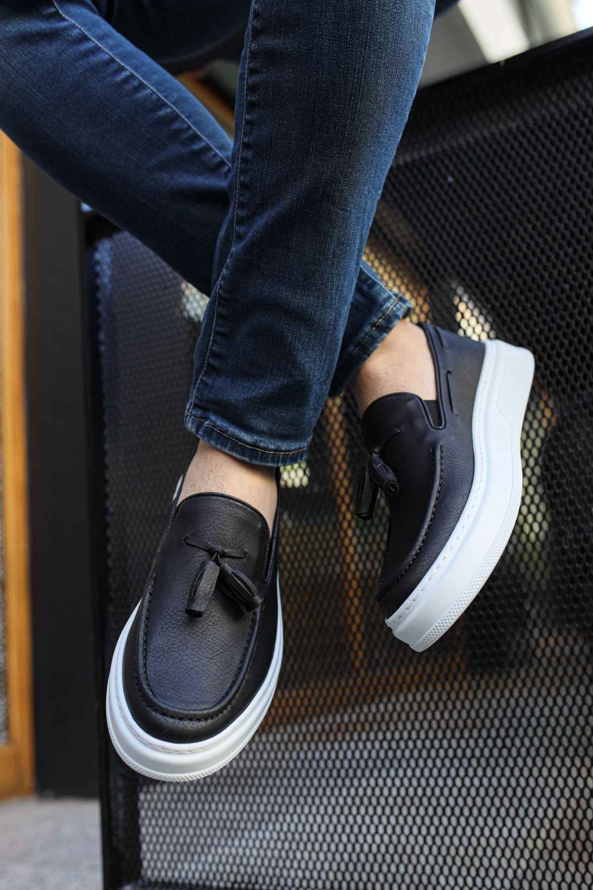 Men's black loafers with bow detail and white sidewall sole