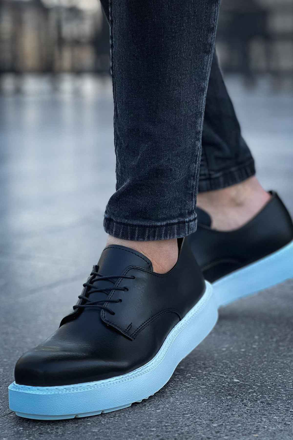 Men's classic black lace-up shoe, side view, light-blue sole