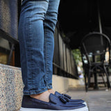 Navy suede loafers with tassel detail, low profile and white rubber sole