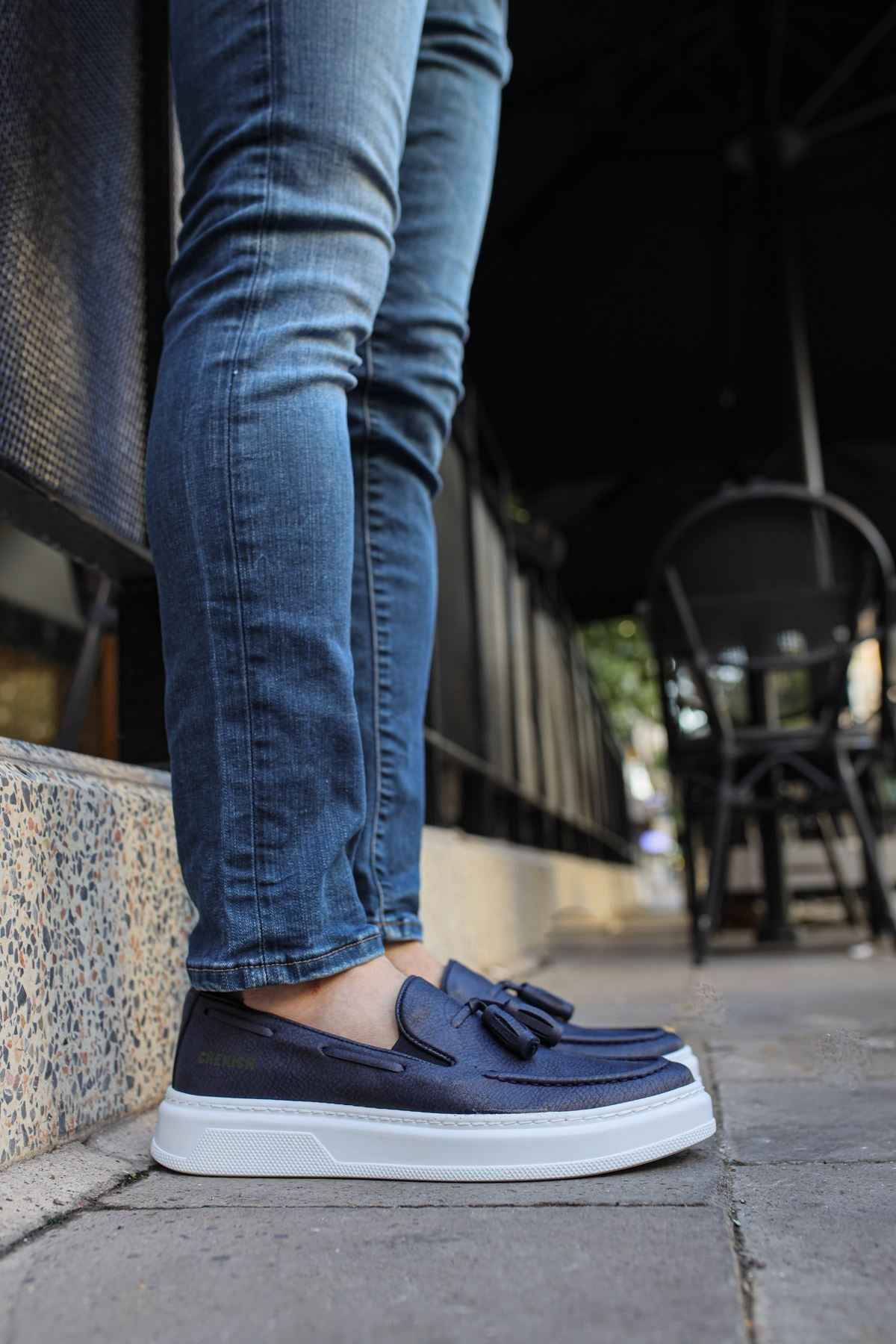 Navy suede loafers with tassel detail, low profile and white rubber sole