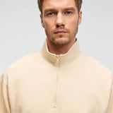 Men's cream half-zip stand-collar sweatshirt, close-up of zipper and collar