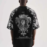 Black oversize men’s T-shirt with ornate back graphic and floral sleeve print