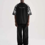 Black oversize men’s T-shirt with centered script graphic