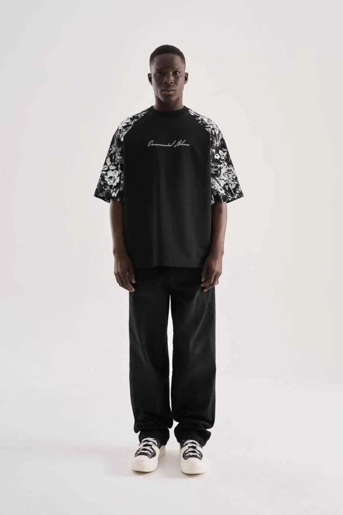 Black oversize men’s T-shirt with centered script graphic