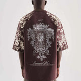 Brown oversize T-shirt with large back floral graphic and script text