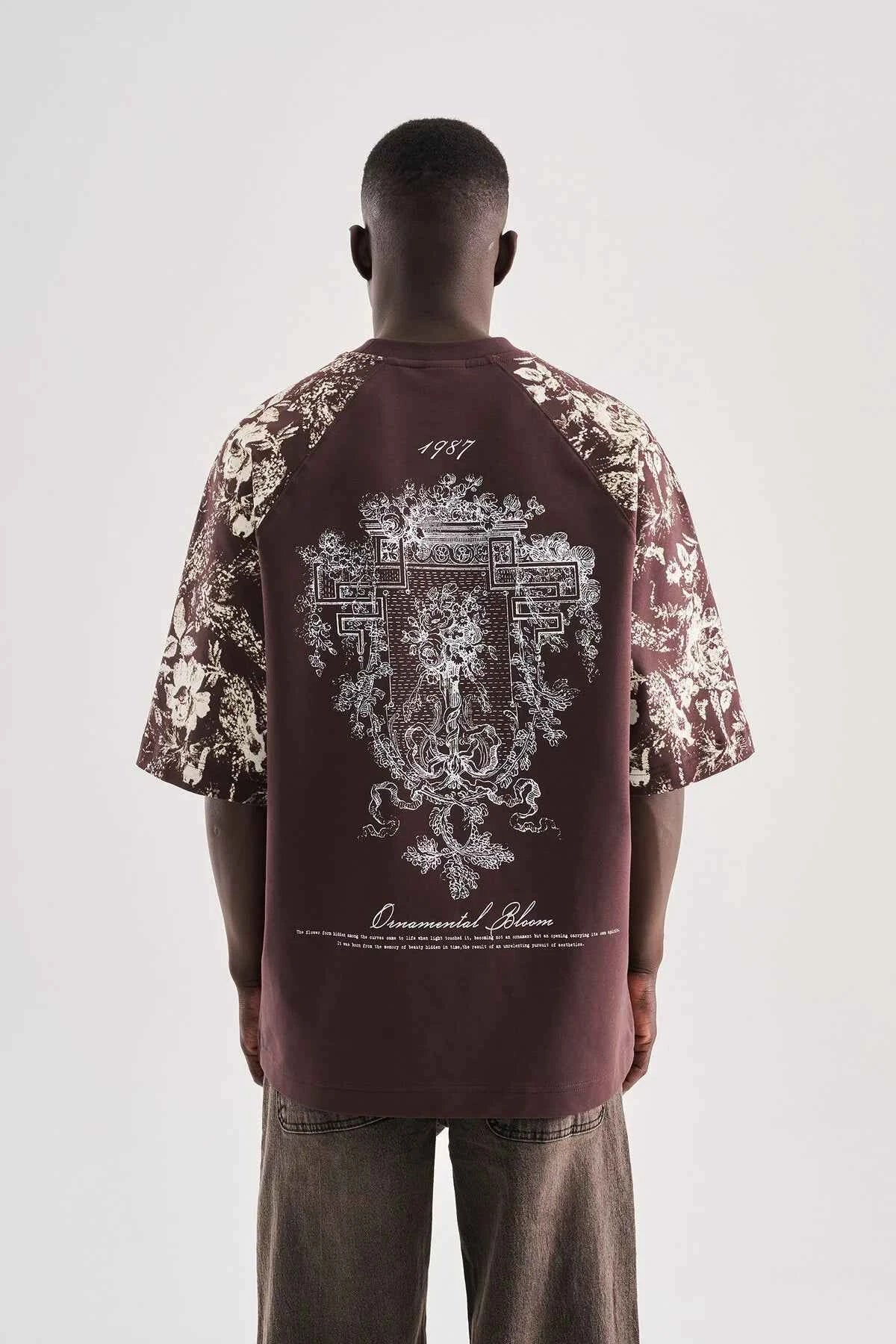 Brown oversize T-shirt with large back floral graphic and script text