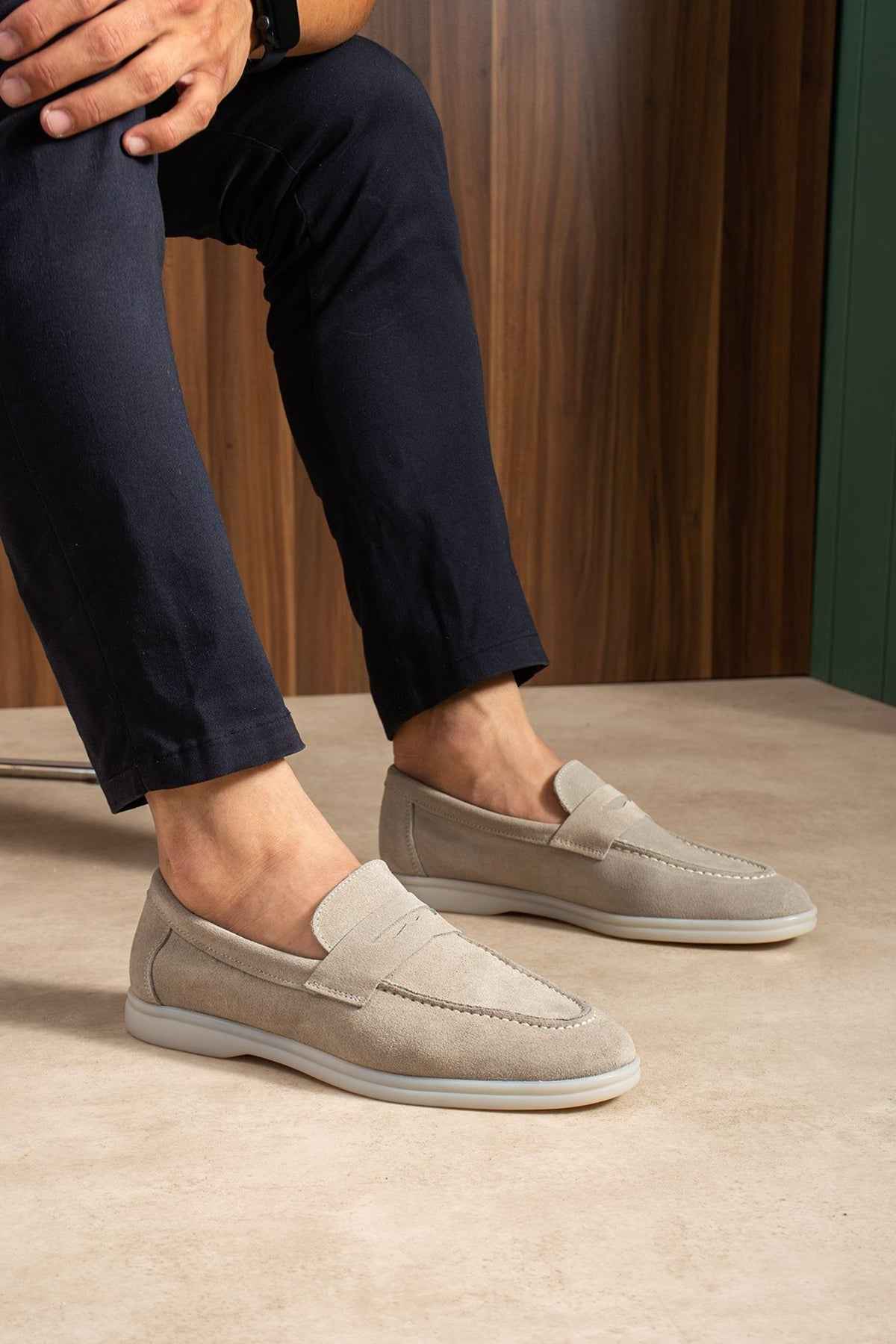 Beige leather loafers, slip-on style with stitched moc-toe detail