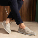 Beige leather loafers with slip-on upper and side seam stitching