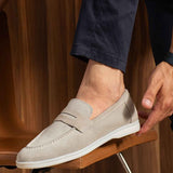 Beige loafers with suede-like finish, strap at vamp, white sole