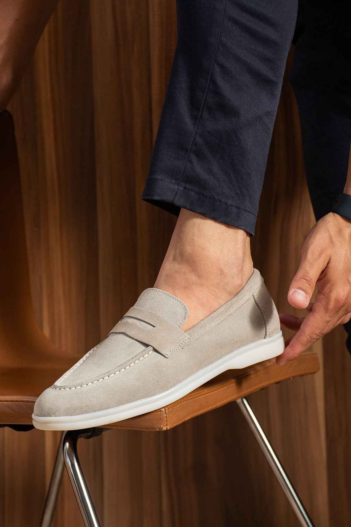 Beige loafers with suede-like finish, strap at vamp, white sole