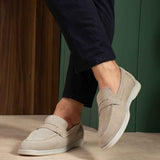 Men's beige leather loafers, side view with moc stitching