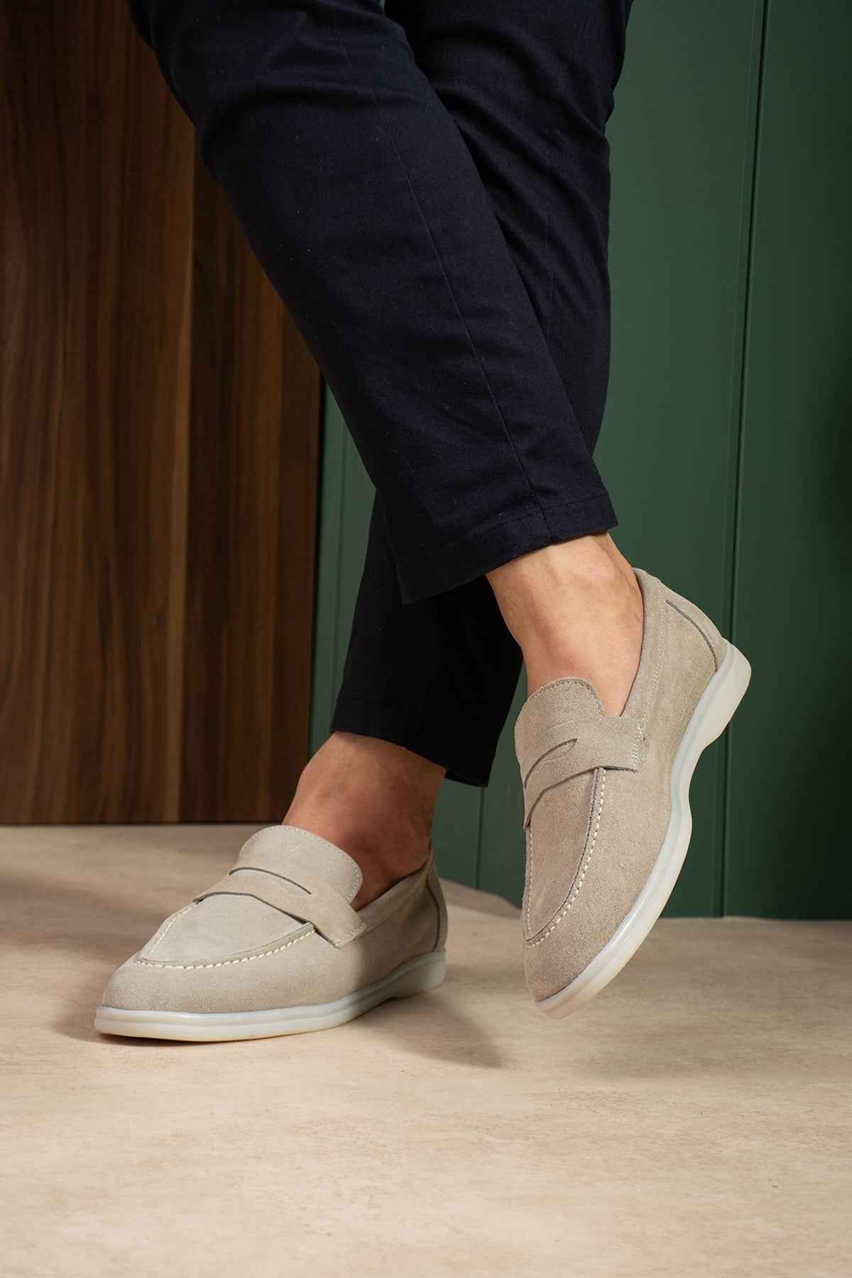Men's beige leather loafers, side view with moc stitching