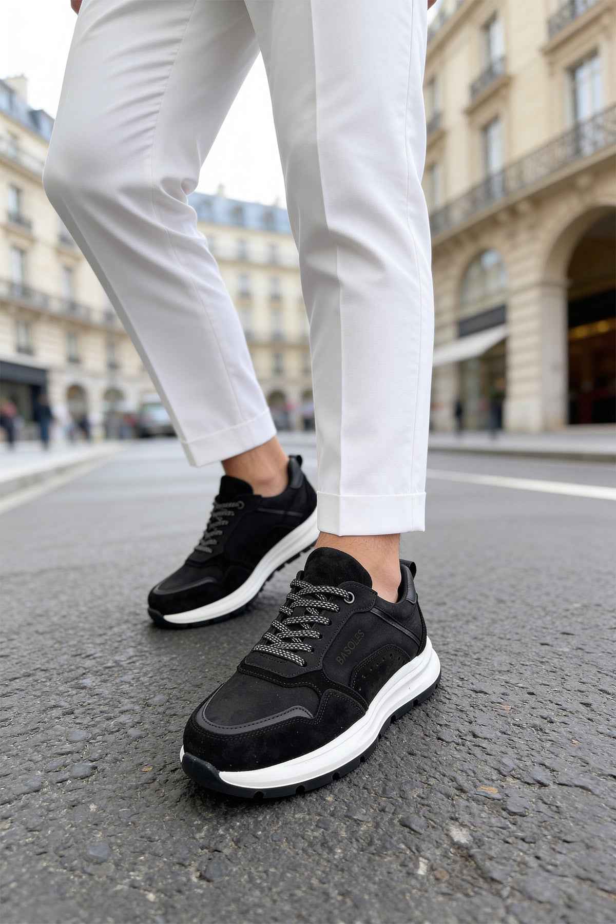 Men's black leather low-top sneakers with lace-up and white sole