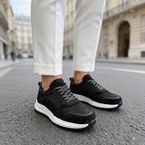 Men's black leather lace-up sneakers with white sole, side view