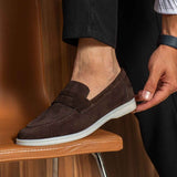 Men's genuine leather loafers, dark brown slip-on with stitched vamp and white sole.