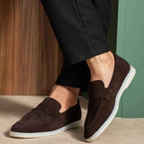 Men's genuine leather loafers, dark brown slip-on with white sole edge, side view.