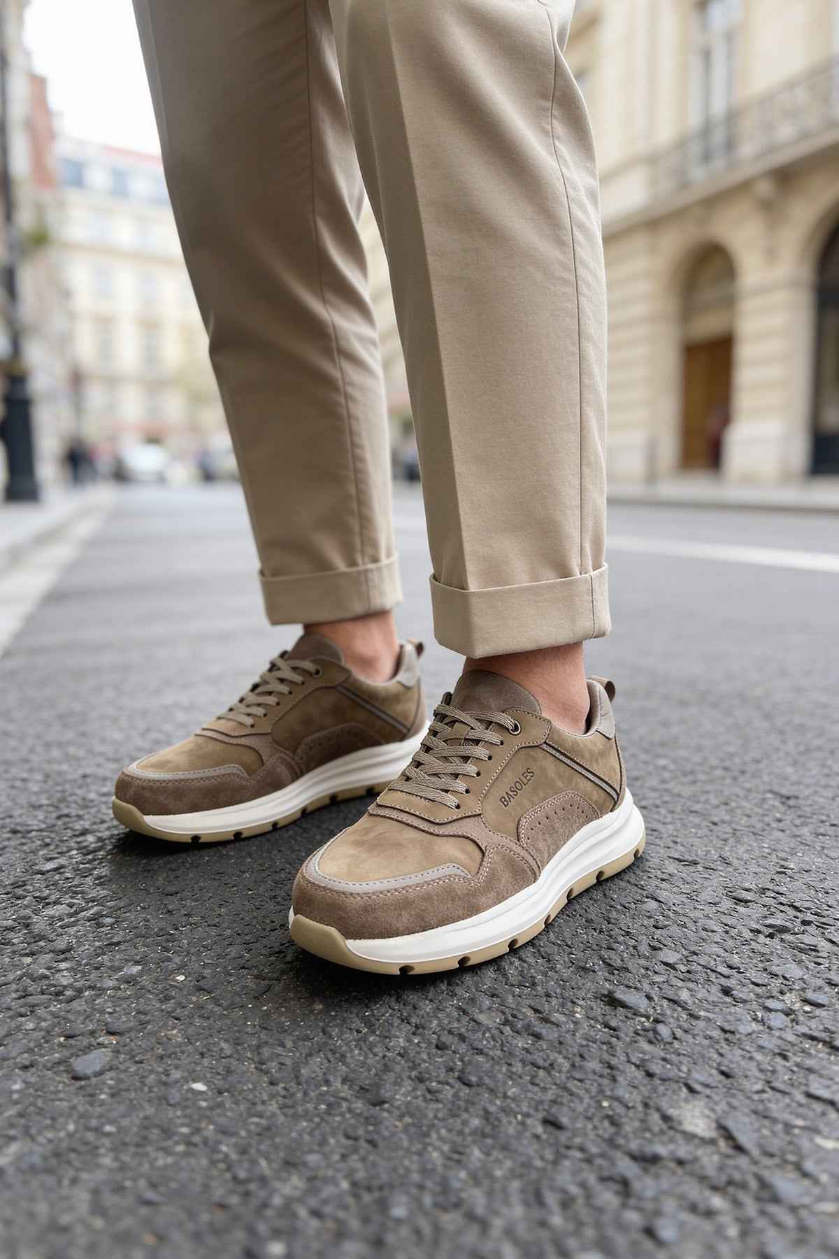 Brown leather sneakers with lace-up closure and thick white sole