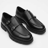 Black leather monk strap shoes pair with strap across vamp and buckles