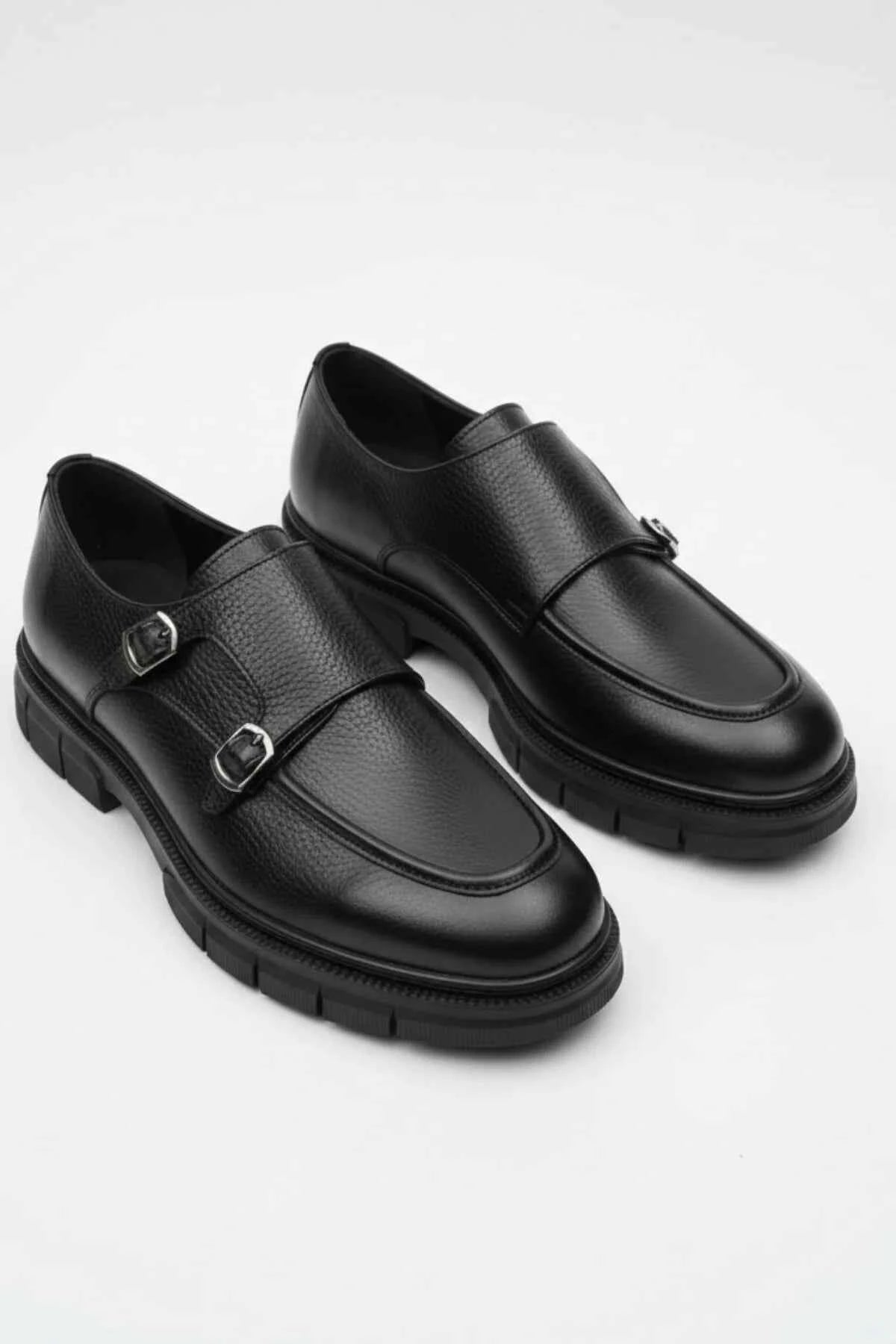 Black leather monk strap shoes pair with strap across vamp and buckles