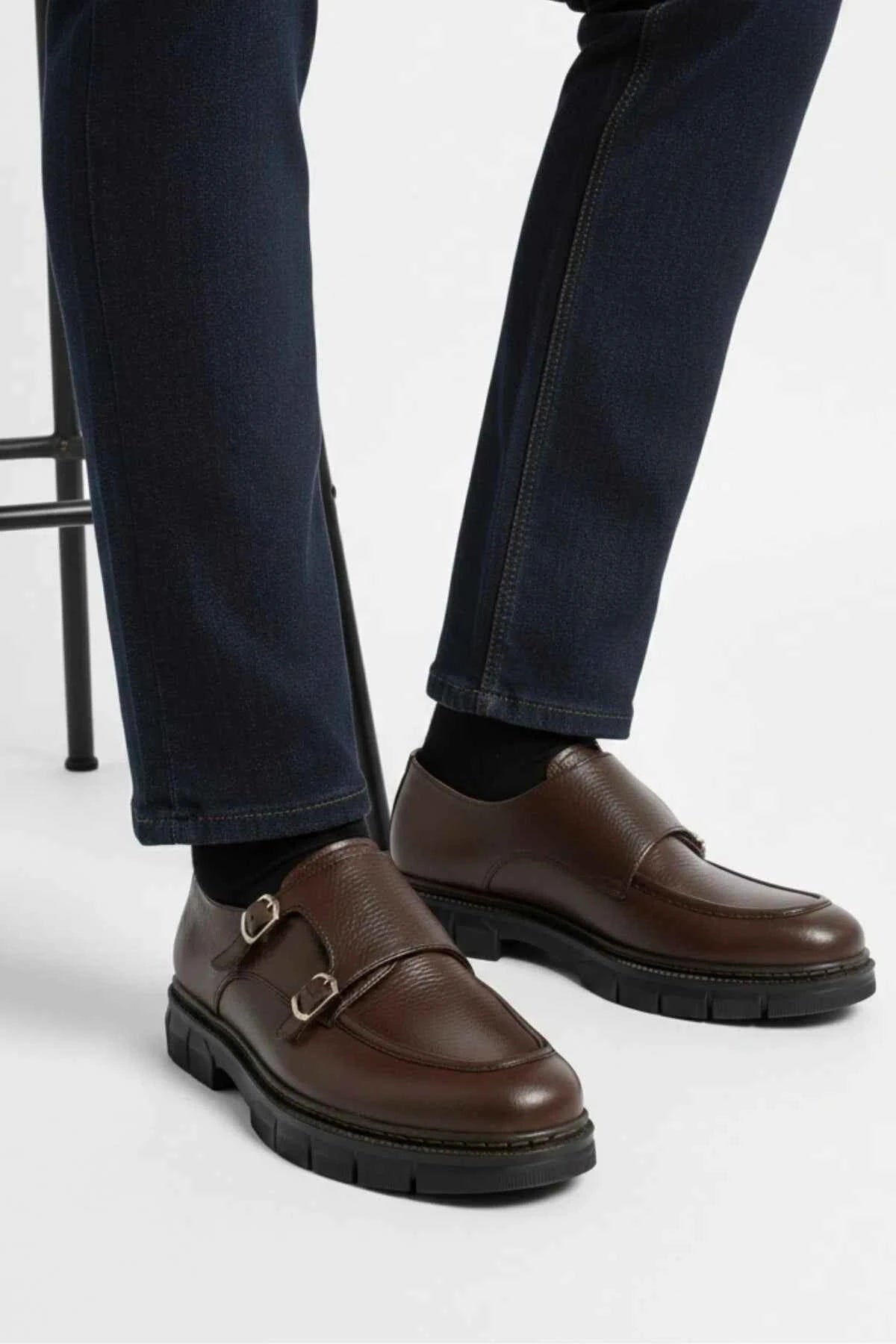 Brown leather double-buckle loafers with black treaded sole