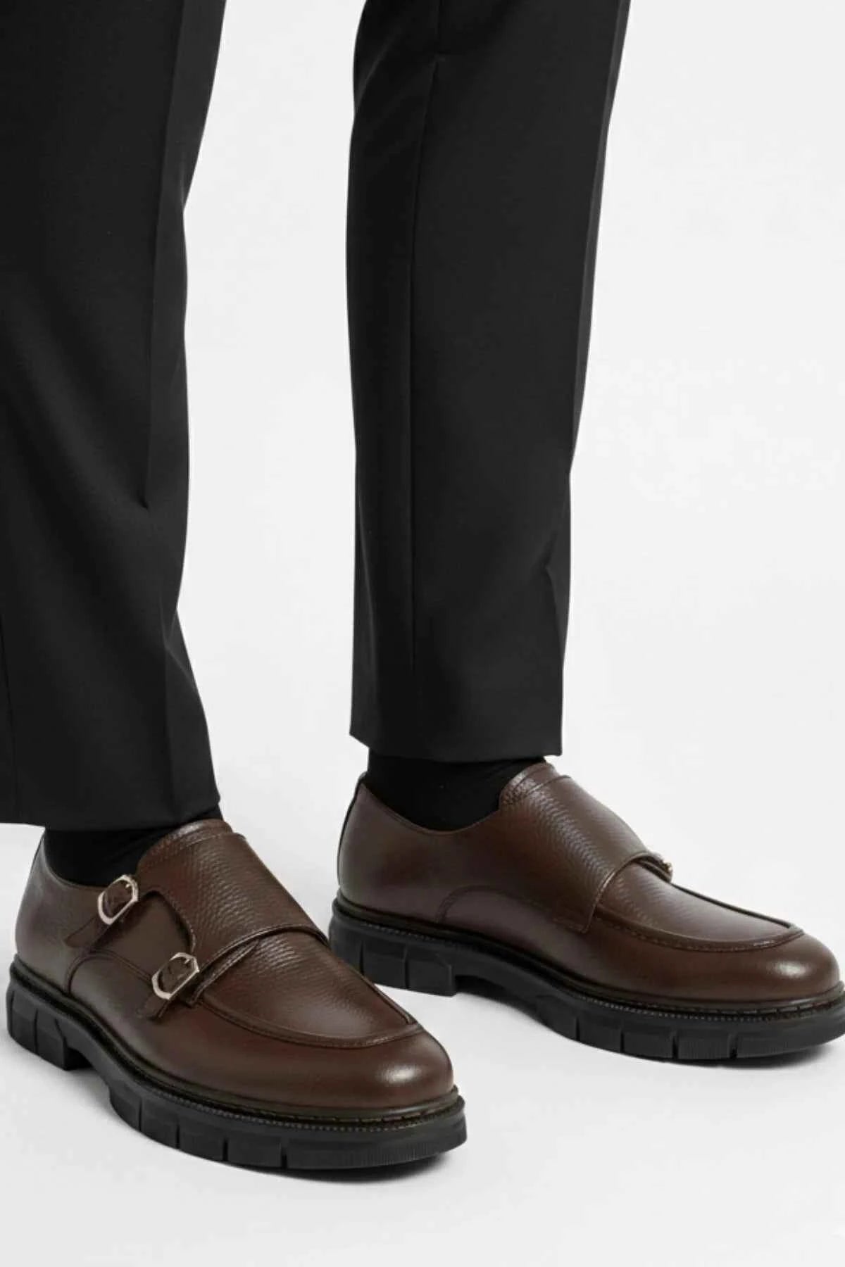 Brown leather double-buckle loafers with thick black sole
