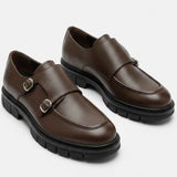 Pair of brown leather double-buckle loafers with black rubber sole