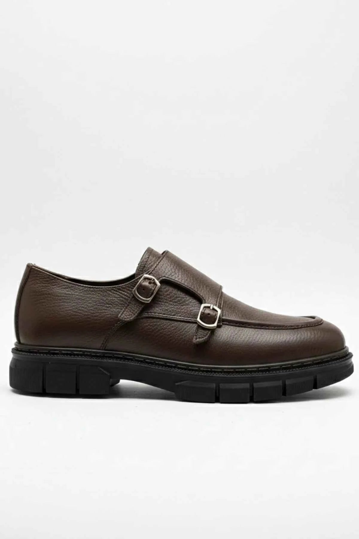 Brown leather double-buckle loafer with rounded toe and chunky black sole
